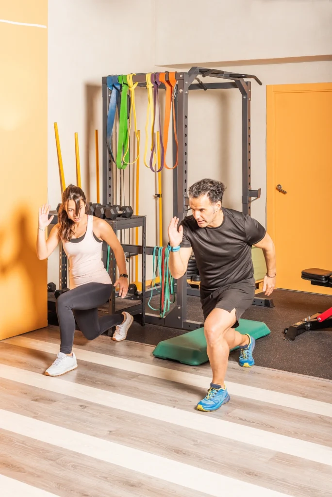 athlete woman and man doing lunges exercises for l 2023 11 27 04 50 01 utc